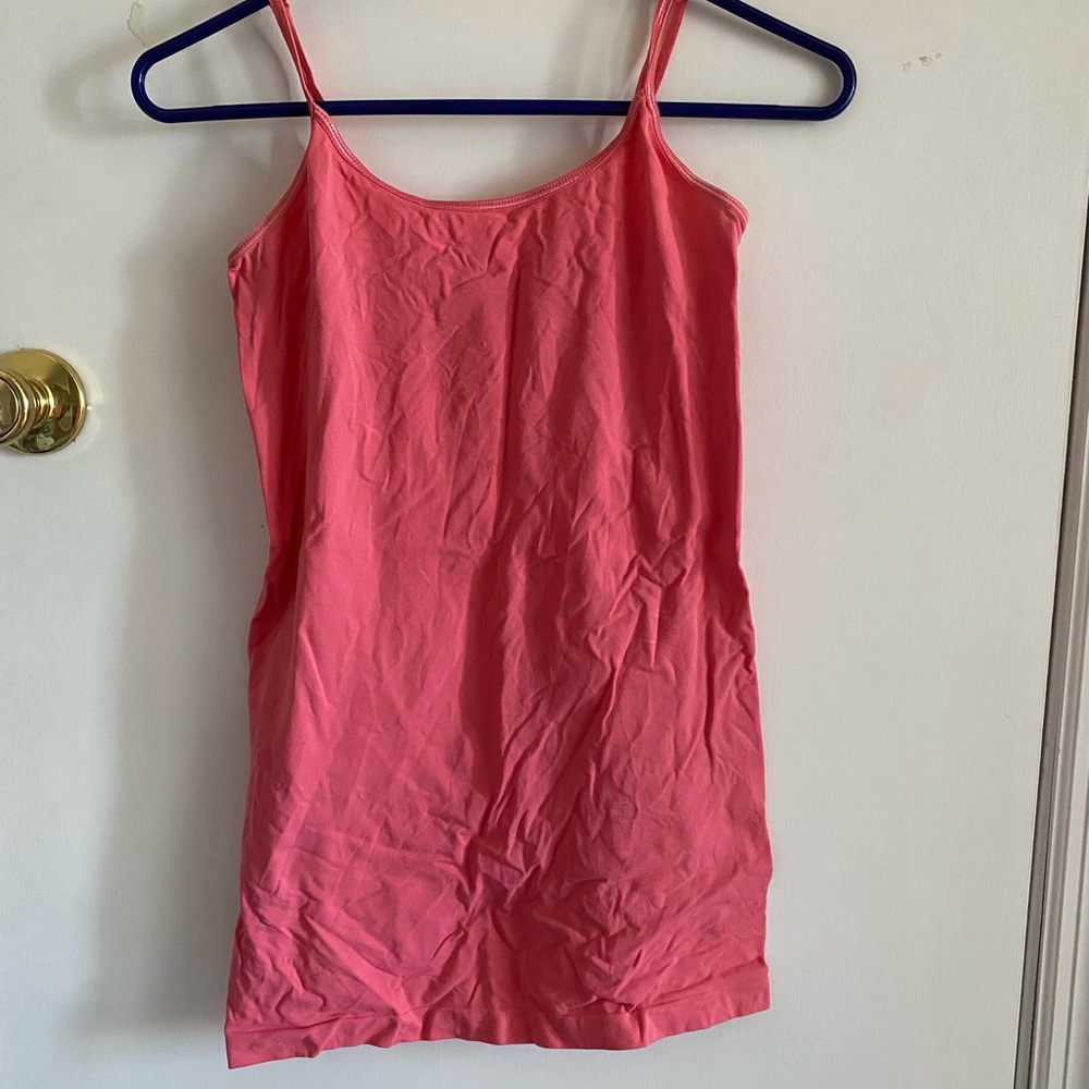Pink cami. Has a little stain as shown in picture but is not noticeable
